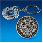 StarCraft pin and WoW keychains