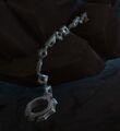 The quest-starting Runeforged Shackles, coiled on the ground.