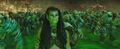 Draka gazes into the sickly green glow of the Great Gate as the Horde rushes past her.