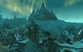 Close-up of the ruins of lower Wintergarde, with Naxxramas in the distance.