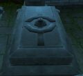 A grave at Stormwind City Cemetery with the symbol.