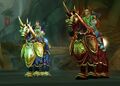 A human and blood elf paladin on their chargers, showing the differences side-by-side